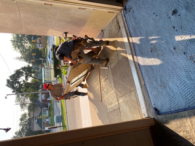 Out with the old door.